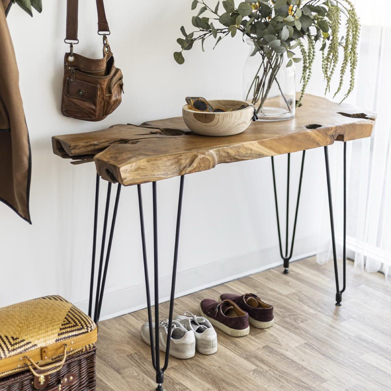 Natural wood console table used in a staged interior